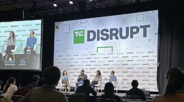 Disrupt conference stage and speakers.
