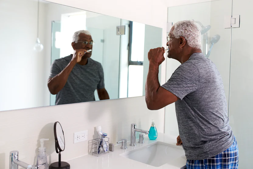 Man brushing his teeth.