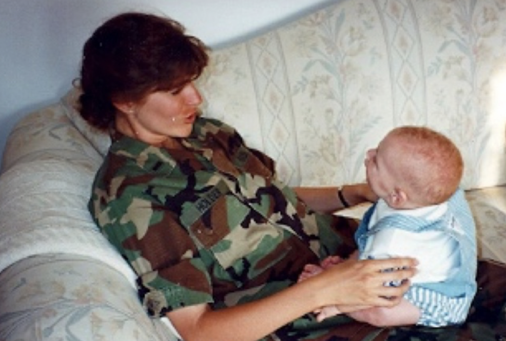 Ann holding a baby.