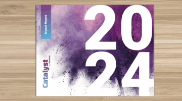 2024 Impact Report book on a table.
