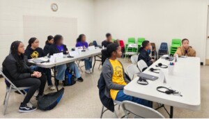 Students in class using tablets.