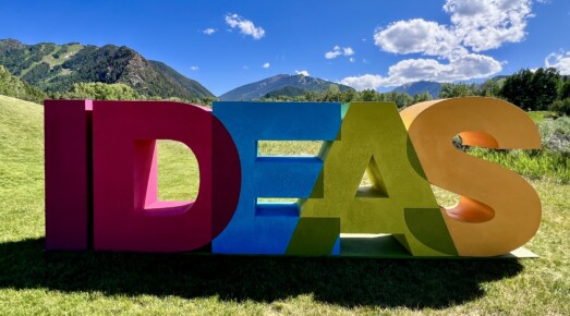 Aspen Ideas sign and mountains on background.