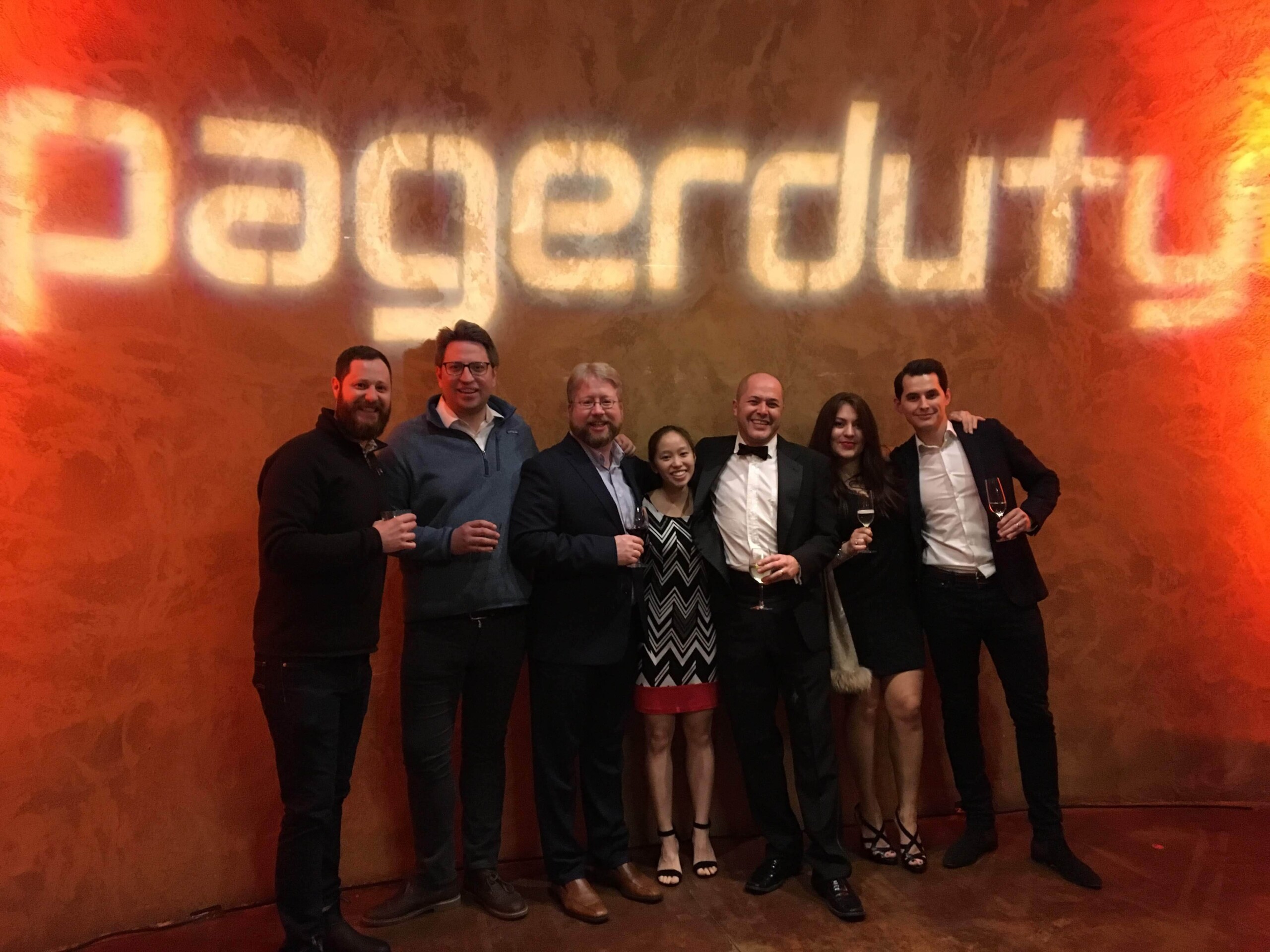 Ophir Ronen and a group win an award on stage.