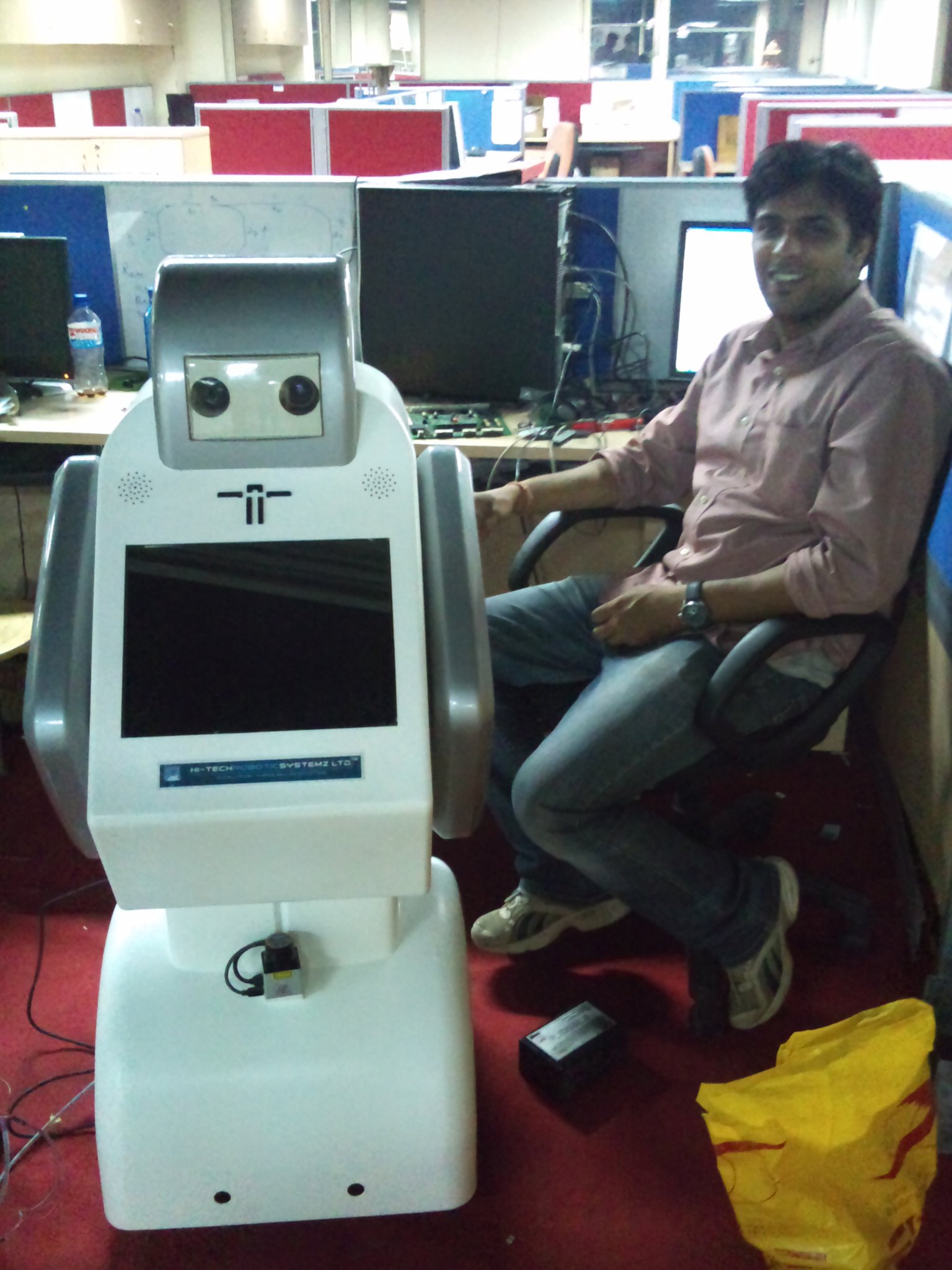 Ritukar working with a robot in an office in 2009.
