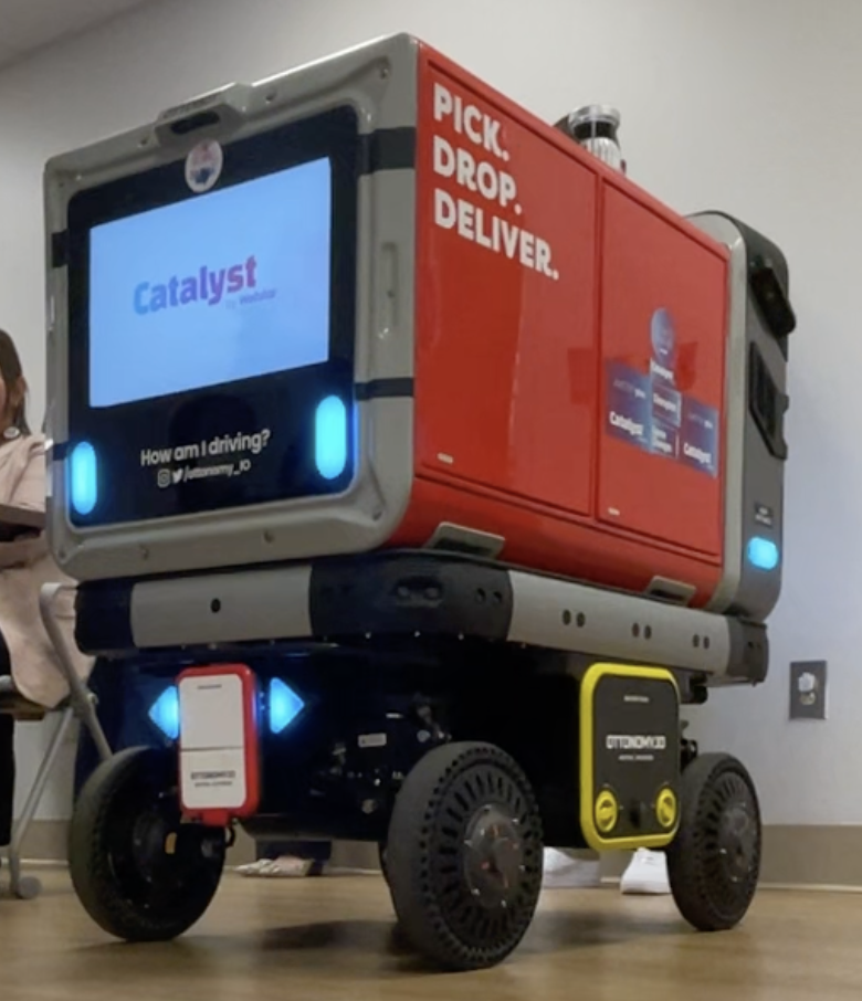 Ottonomy robot with a screen showing the Catalyst logo.