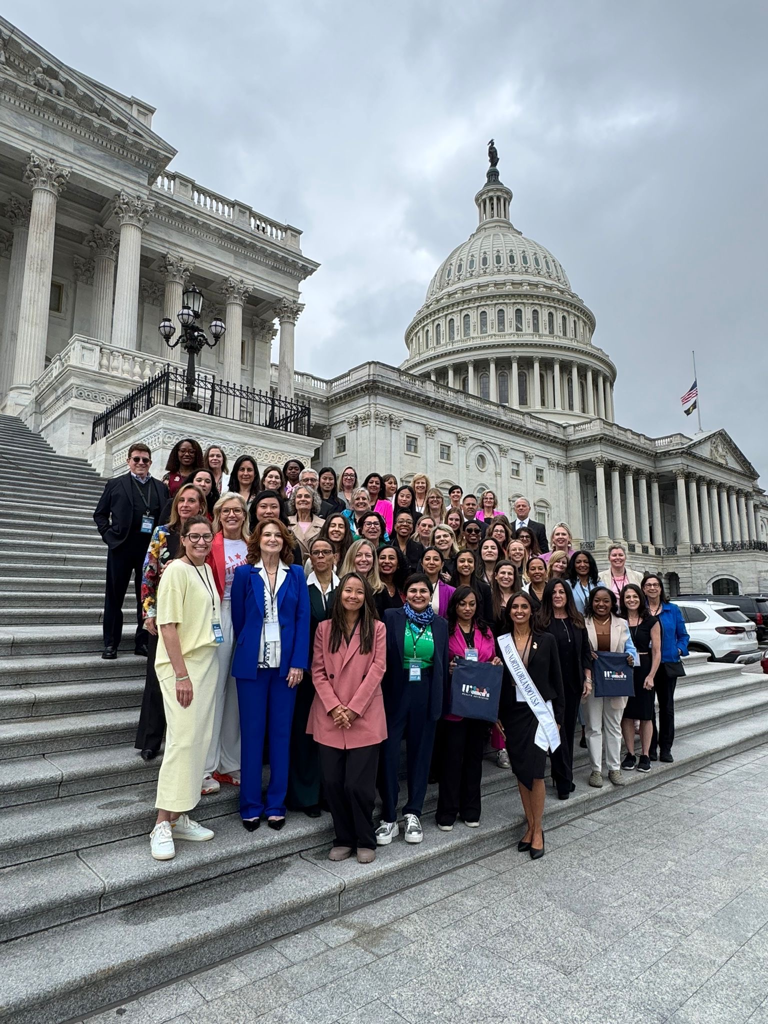 Jannine Versi and a group of women at the Washington capitol steps.